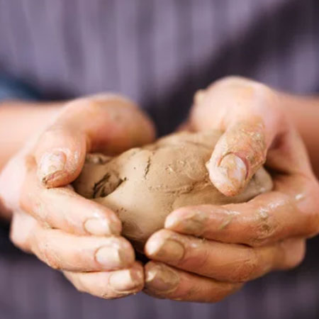 Art therapy person molding clay