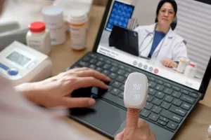 Asian Woman Using Telemedicine for Doctor Visit at Home