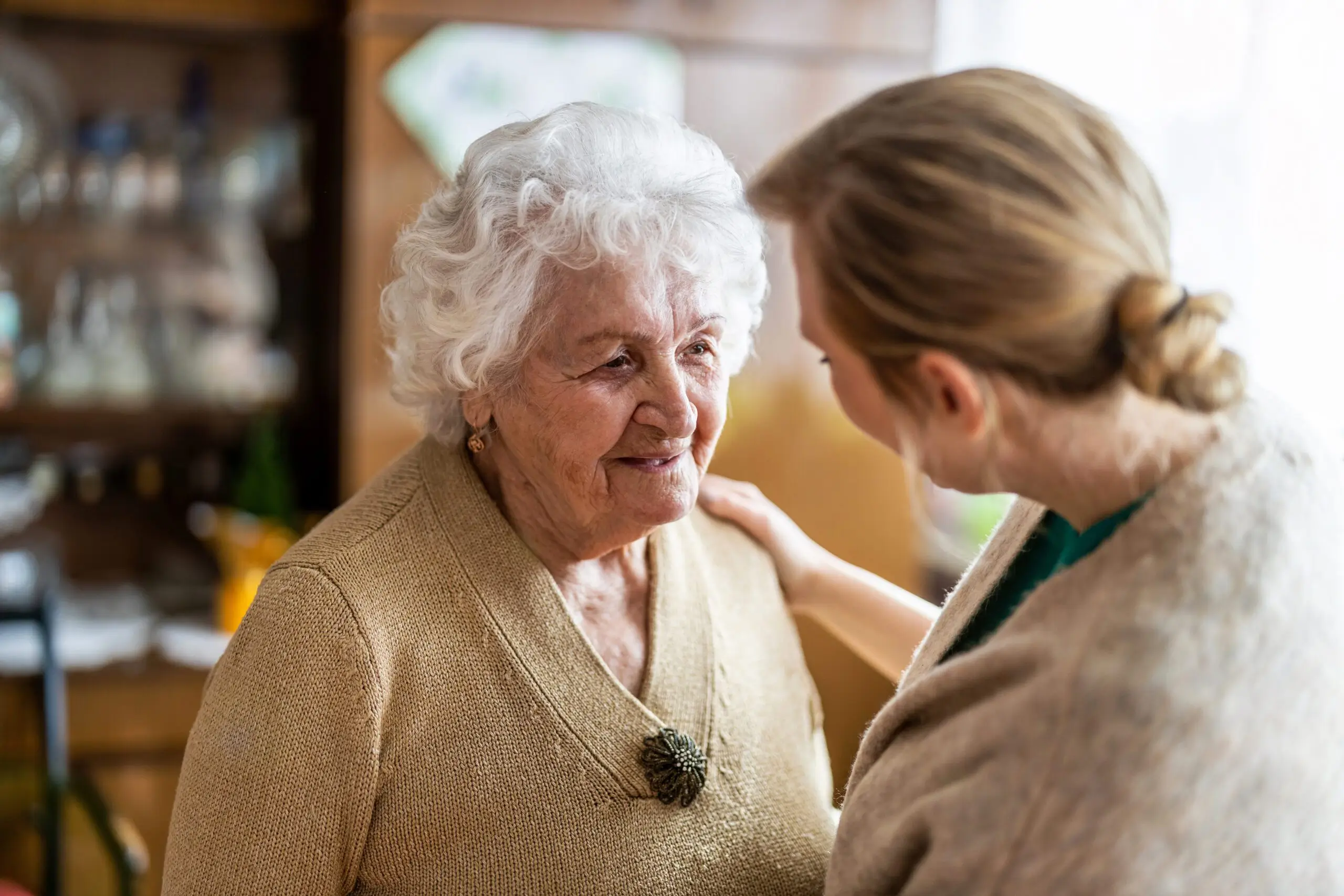 Community Care Corps Elderly Woman Engaging with Caregiver