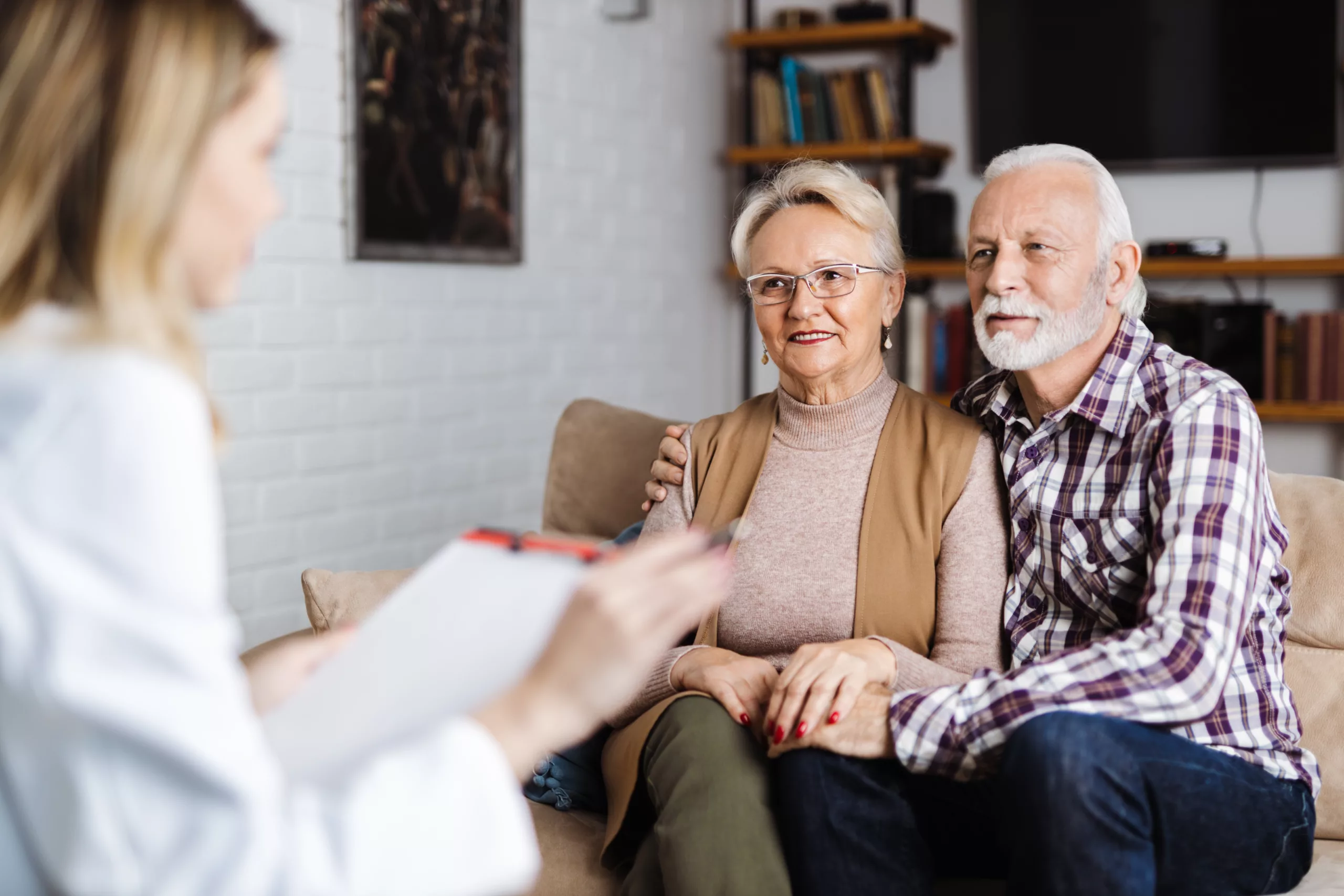 Medical Professionals Chatting with Caregiver & Patient